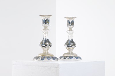 Lot 323 - A pair of enamel and parcel-gilt glass candlesticks