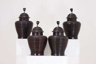 Lot 484 - A set of four glazed pottery table lamp bases