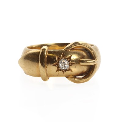 Lot 1027 - An 18ct gold diamond set  buckle ring