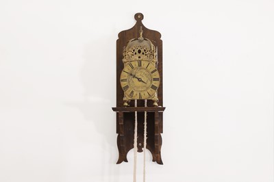 Lot 354 - A brass lantern clock