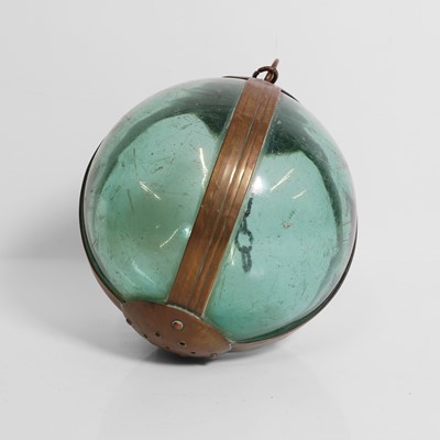Lot 31 - A brass-mounted pale-green glass buoy or fishing float