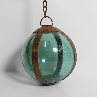 Lot 31 - A brass-mounted pale-green glass buoy or fishing float