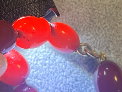 Lot 222 - A uniform single row Bakelite bead necklace