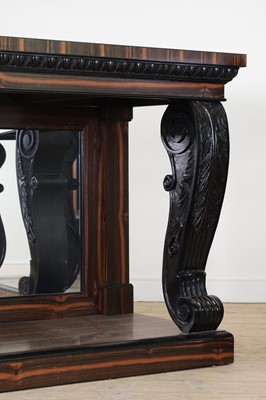 Lot 629 - A pair of Regency-style coromandel and ebonised pier tables