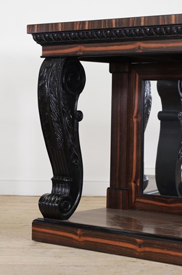 Lot 629 - A pair of Regency-style coromandel and ebonised pier tables