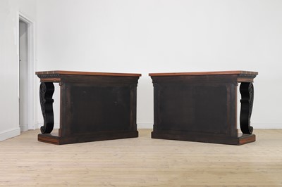 Lot 629 - A pair of Regency-style coromandel and ebonised pier tables