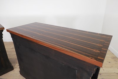 Lot 629 - A pair of Regency-style coromandel and ebonised pier tables