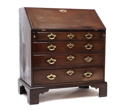 Lot 332 - A George III 'red walnut' bureau