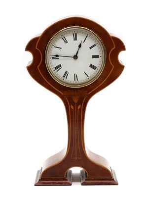 Lot 276 - An Art Nouveau inlaid mahogany balloon mantel clock