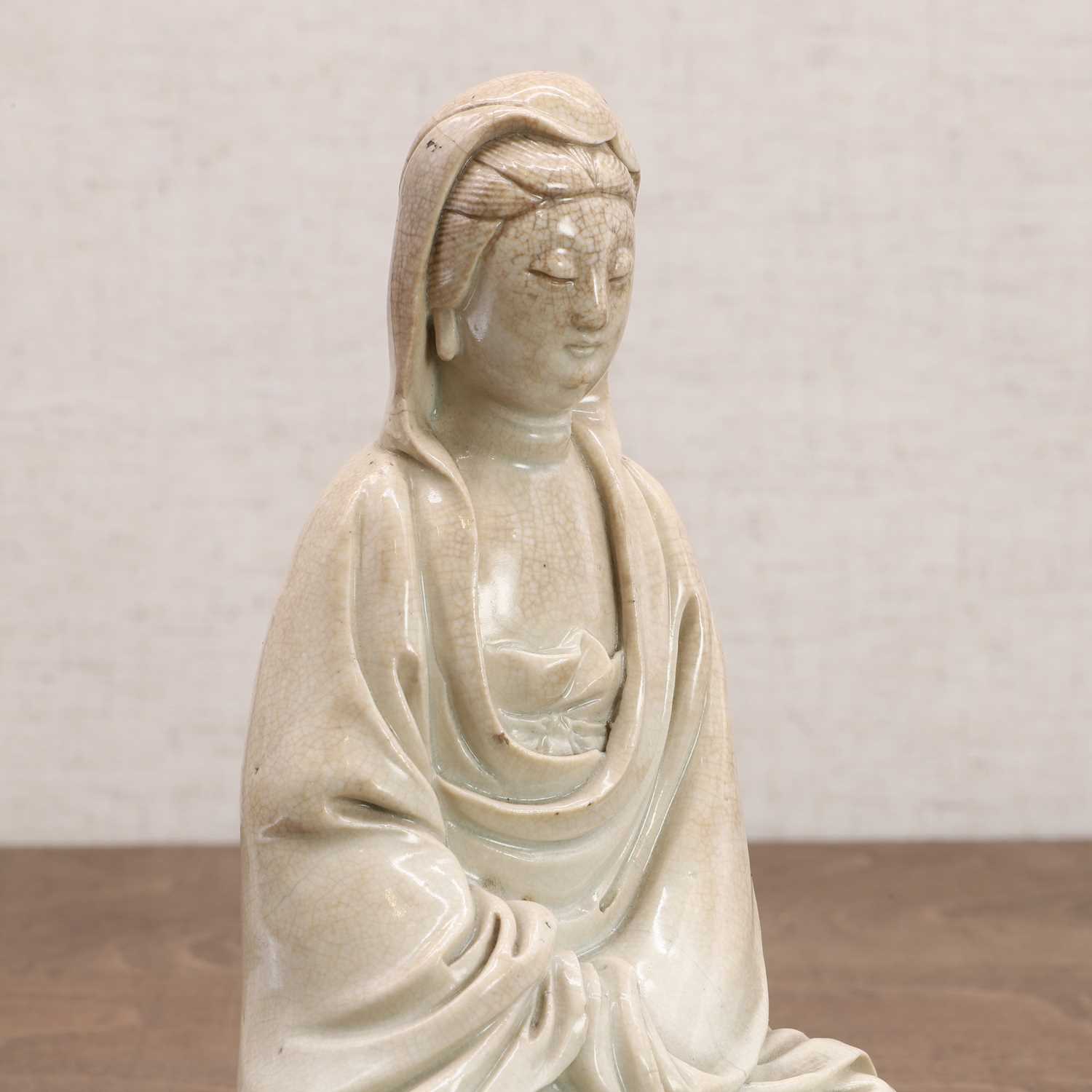 Lot 94 - A Chinese porcelain guanyin