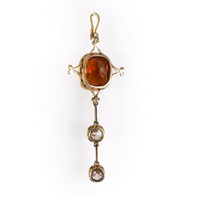 Lot 38 - An Edwardian hessonite garnet and diamond pendant