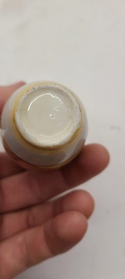 Lot 213 - A set of four Clarice Cliff miniature vases