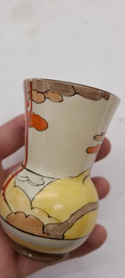 Lot 213 - A set of four Clarice Cliff miniature vases