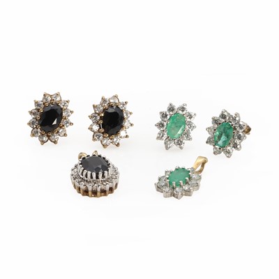 Lot 1144 - An emerald cluster earring and pendant suite