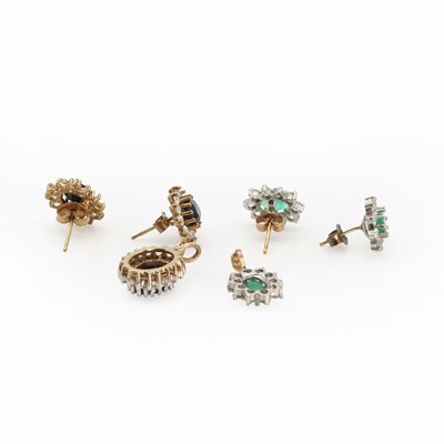 Lot 1144 - An emerald cluster earring and pendant suite
