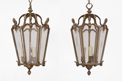 Lot 141 - A pair of Louis XV-style silvered-brass lanterns