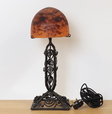 Lot 260 - A Daum glass and wrought iron table lamp