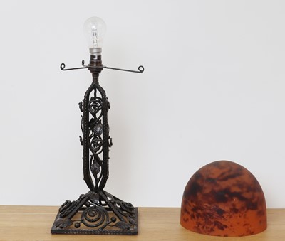 Lot 260 - A Daum glass and wrought iron table lamp