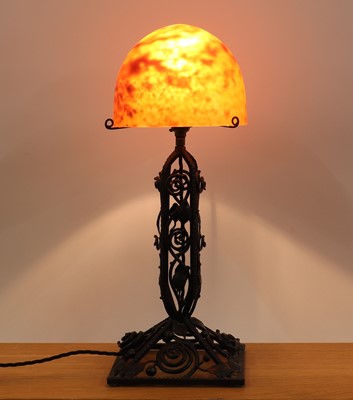 Lot 260 - A Daum glass and wrought iron table lamp