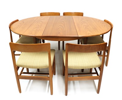 Lot 431 - An extending teak dining table