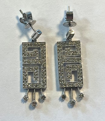 Lot 44 - A pair of white gold diamond drop earrings