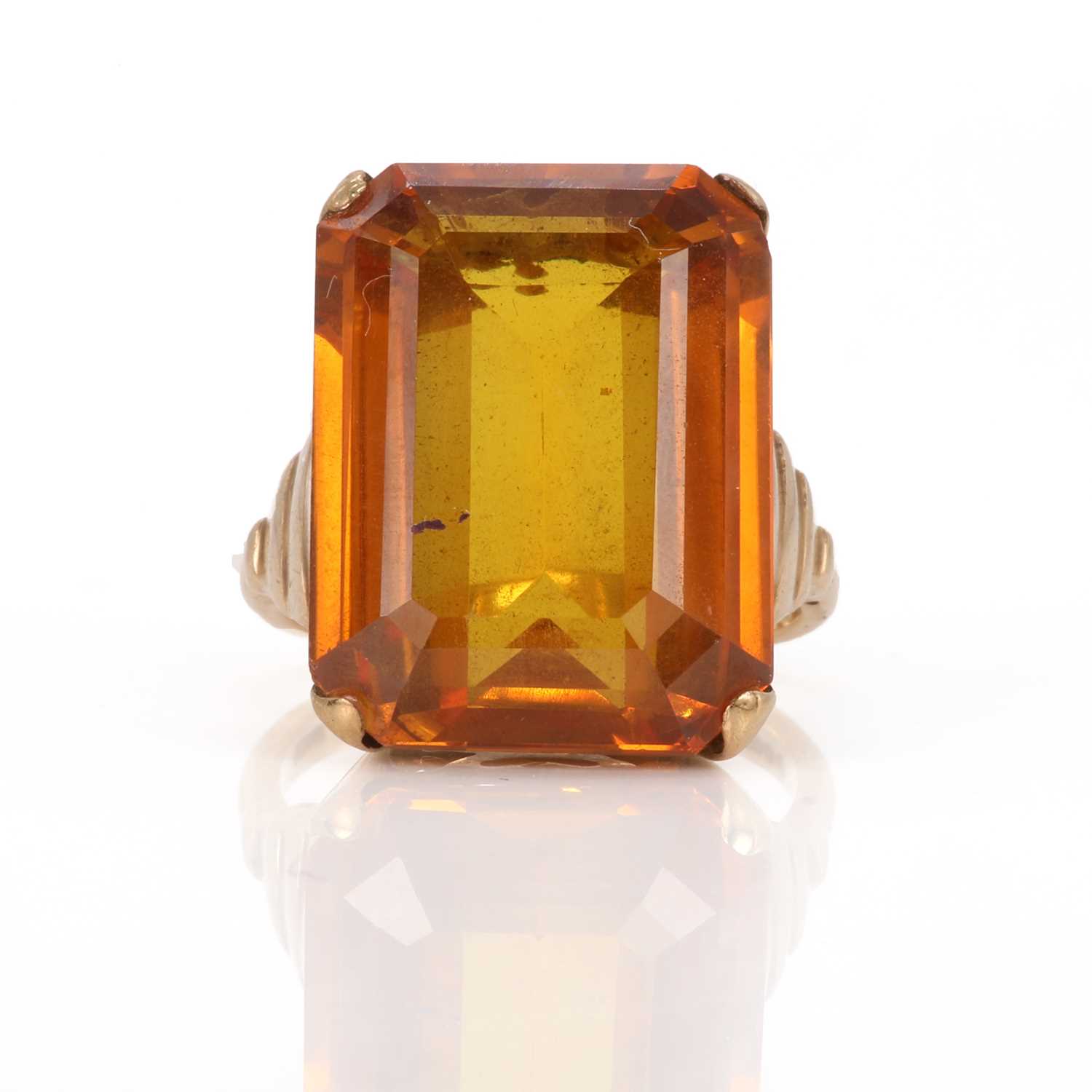 Lot 80 - A single stone synthetic yellow sapphire ring
