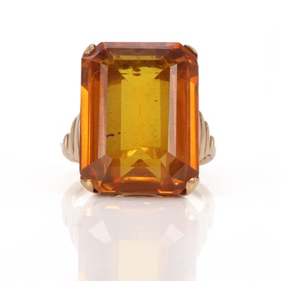 Lot 80 - A single stone synthetic yellow sapphire ring
