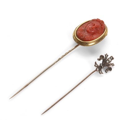 Lot 4 - An antique coral cameo stick pin and a seed pearl stick pin