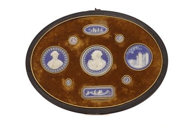 Lot 244 - A framed porcelain roundel display