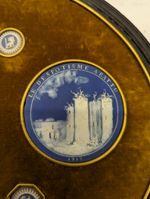 Lot 244 - A framed porcelain roundel display