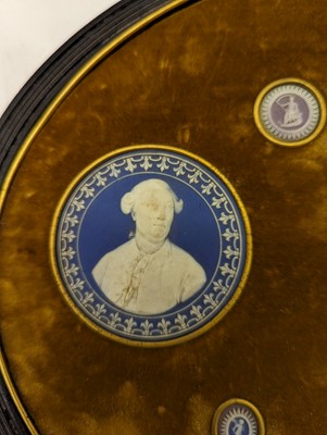 Lot 244 - A framed porcelain roundel display