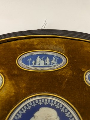 Lot 244 - A framed porcelain roundel display