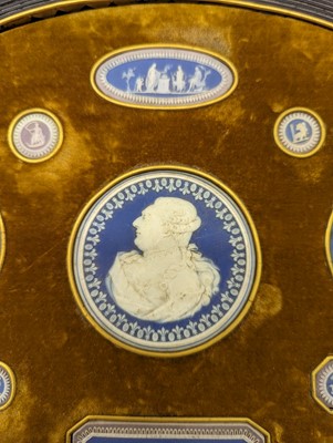 Lot 244 - A framed porcelain roundel display