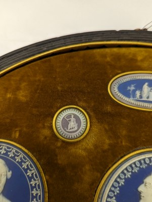 Lot 244 - A framed porcelain roundel display