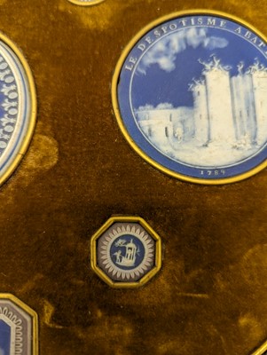 Lot 244 - A framed porcelain roundel display