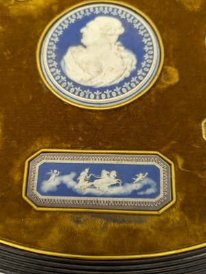 Lot 244 - A framed porcelain roundel display