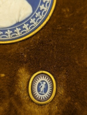 Lot 244 - A framed porcelain roundel display