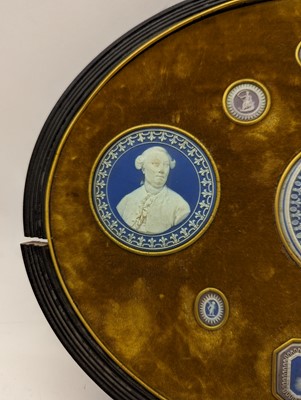 Lot 244 - A framed porcelain roundel display