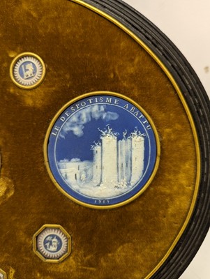 Lot 244 - A framed porcelain roundel display