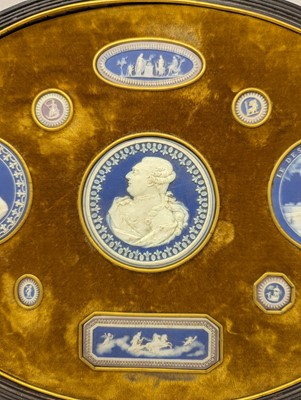 Lot 244 - A framed porcelain roundel display