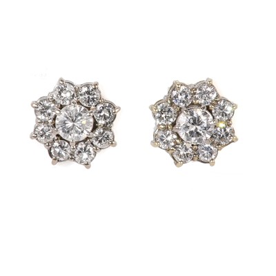 Lot 55 - A pair of 18ct yellow and white gold diamond cluster earrings
