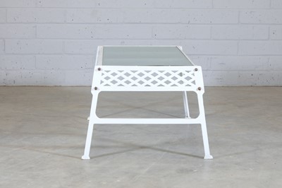 Lot 182 - A cast iron garden table