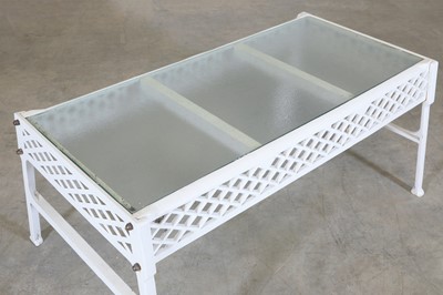 Lot 182 - A cast iron garden table