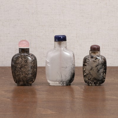 Lot 149 - Three Chinese tourmalinated-quartz snuff bottles