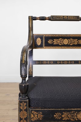 Lot 10 - A Regency-style ebonised and parcel-gilt chair-back settee