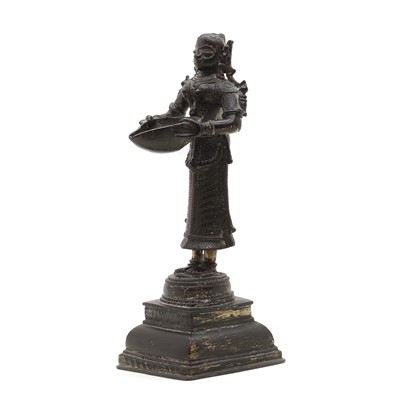 Lot 142 - A bronze Dipa Lakshmi oil lamp
