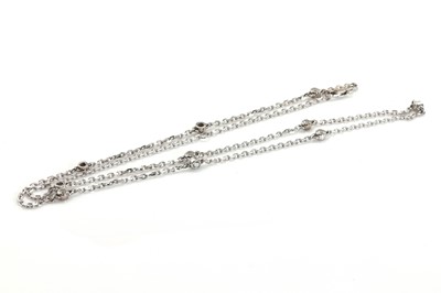 Lot 48 - An 18ct white gold diamond station necklace