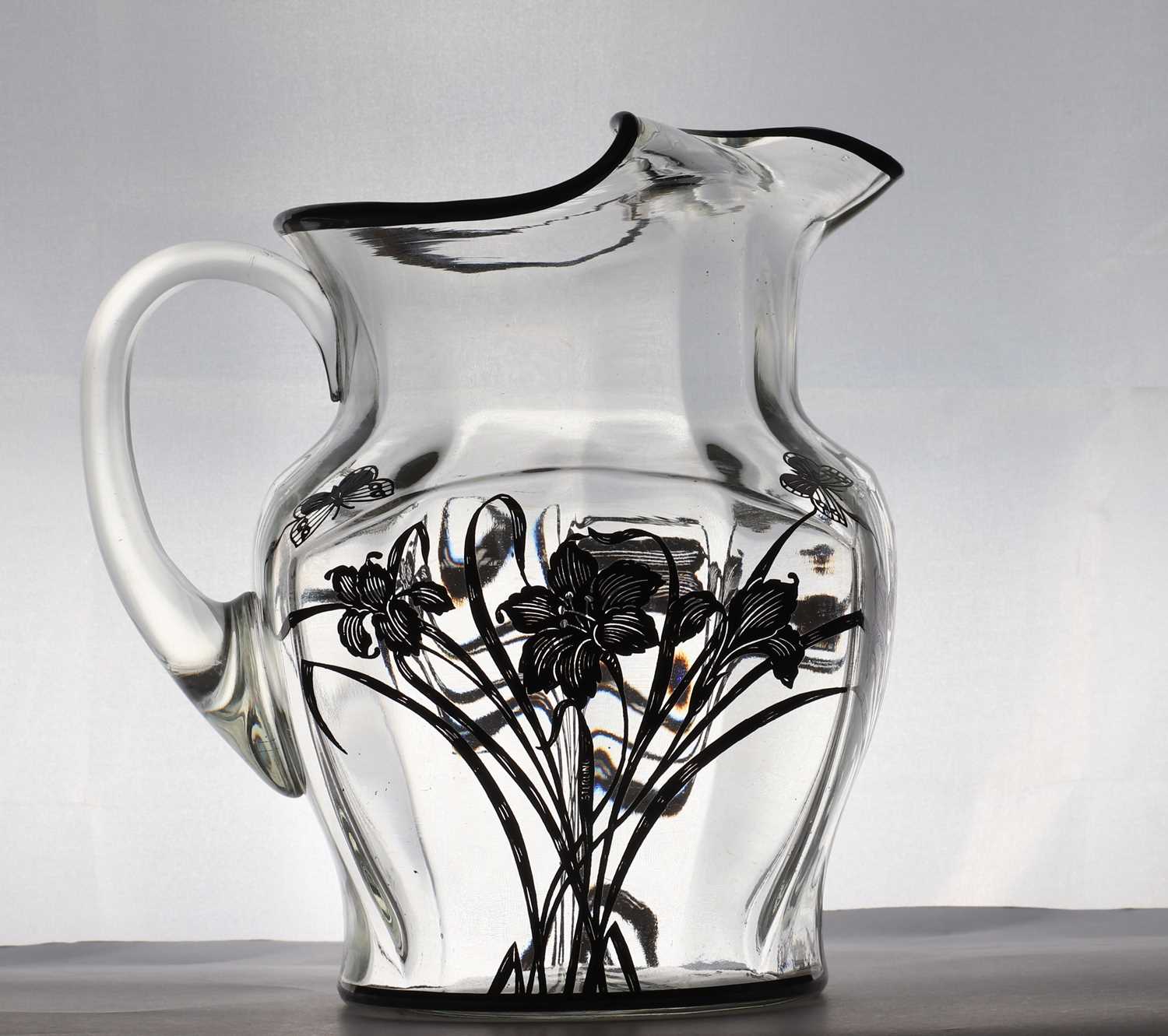 Lot 93 - A silver overlaid glass water jug