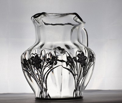 Lot 93 - A silver overlaid glass water jug