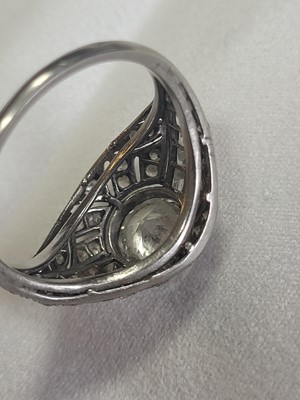 Lot 69 - A French Art Deco platinum and diamond bombé ring